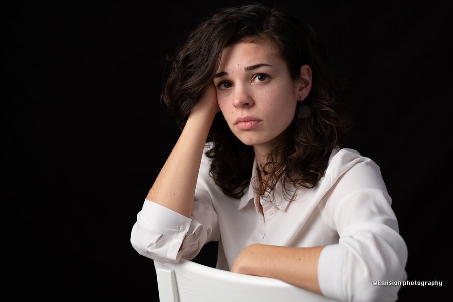 Close studio portrait study against a dark backdrop